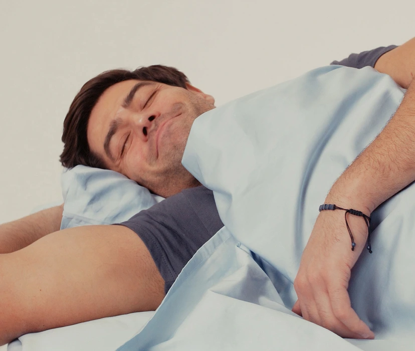Man smiling in bed